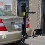 Burbank Electropedic TRILIFT Ultra Lite With a Bracket for manual wheelchair on a Toyota Camry.